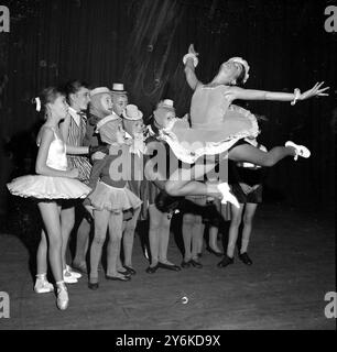 Susan Collins (14) soars gracefully through the air watched by open-mouthed youngsters at the Rudolf Steiner Theatre in London.  All competing in the semi-finals of the Fifth National Awards Contest organised by the Arts Association of Stage Schools which makes annual grants to a number of promising performers.  10th October 1958.` ©TopFoto Stock Photo